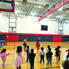 Wonder Woman and Superman teach kids power poses. photo by Mercedes Duckworth